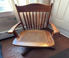 Beautiful Antique golden oak office swivel chair w/original cane seat